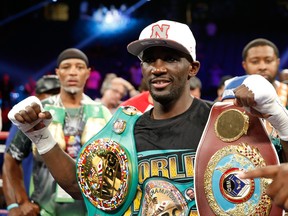 WBO junior welterweight champion Terence Crawford poses with belts after his unanimous decision victory over WBC champion Viktor Postol of Ukraine at MGM Grand Garden Arena on July 23, 2016 in Las Vegas, Nevada. (Steve Marcus/Getty Images)
