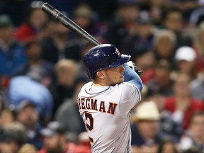 Alex Bregman of the Houston Astros hits a two-run home run in the fifth inning of a game against the Boston Red Sox at Fenway Park on September 29, 2017 in Boston, Massachusetts. (Adam Glanzman/Getty Images)