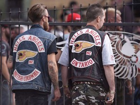 Members of the Hells Angels from British Columbia and Ontario enter the Hells Angels Nomads compound during the group's Canada Run event in Carlsbad Springs, Ont., near Ottawa, on Saturday, July 23, 2016.