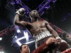 Terence Crawford celebrates after defeating Jeff Horn, of Australia, in a welterweight title boxing match, Saturday, June 9, 2018, in Las Vegas. (AP Photo/John Locher)