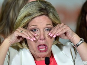 Ontario NDP leader Andrea Horwath wipes away tears at her Ontario provincial election night headquarters in Hamilton, Ontario on Thursday, June 7, 2018.