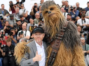 Director Ron Howard poses with Chewbacca (in costume) at the photocall for "Solo:  A Star Wars Story" during the 71st annual Cannes Film Festival at Palais des Festivals on May 15, 2018 in Cannes, France.