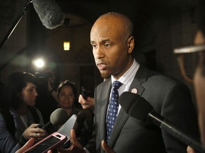Minister of Immigration, Refugees and Citizenship Ahmed Hussen speaks to reporters outside the House of Commons on Parliament Hill on Thursday, May 31, 2018.