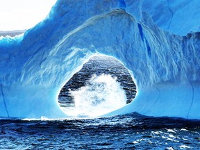 An iceberg is seen in Amherst Cove, N.L. on June 4, 2018 in this handout photo.