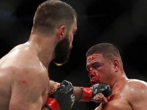 Andrei Arlovski, left, lands a punch on Tai Tuivasa during a heavyweight UFC 225 Mixed Martial Arts bout Saturday, June 9, 2018, in Chicago.