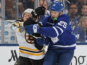 Charlie McAvoy of the Boston Bruins collides with James van Riemsdyk of the Toronto Maple Leafs in the Stanley Cup playoffs at the Air Canada Centre on April 19, 2018 in Toronto. (Claus Andersen/Getty Images)