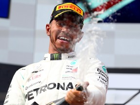 Race winner Lewis Hamilton celebrates on the podium during the Formula One Grand Prix of France at Circuit Paul Ricard on June 24, 2018 in Le Castellet, France. (Dan Istitene/Getty Images)