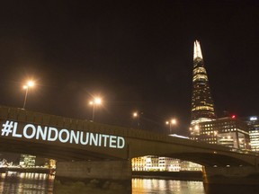 A tribute is projected onto the side of London Bridge, London, Sunday June 3, 2018, to mark one year since a deadly vehicle-and-knife attack on London Bridge.
