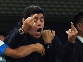 Retired Argentina player Diego Maradona gestures during the World Cup match between Nigeria and Argentina at the Saint Petersburg Stadium in Saint Petersburg on June 26, 2018.(Getty Images)