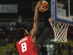 Canada's Andrew Wiggins, left, goes for a shot over Uruguay's Kiril Wachsmann during a FIBA Americas Championship basketball game in Mexico City, Monday Sept. 7, 2015. (Emanuel Miller not pictured)
