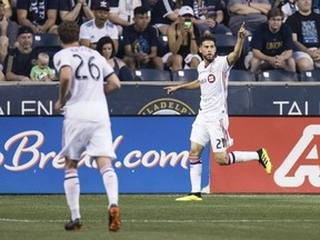 Toronto FC's Jonathan Osorio, right, reacts to his goal during the first half of an MLS soccer match against the Philadelphia Union, Friday, June 8, 2018, in Chester, Pa.