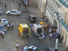 In this image provided by Moscow Traffic Control Center Press Service, ambulance and police work at the site of an incident after a taxi crashed into pedestrians on a sidewalk near Red Square in Moscow, Russia, Saturday, June 16, 2018. (Moscow Traffic Control Center Press Service via AP)
