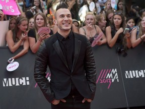 Shawn Desman poses on the red carpet during the 2013 Much Music Video Awards in Toronto on Sunday June 16, 2013. (THE CANADIAN PRESS/Nathan Denette)
