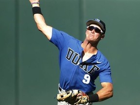 Duke's Griffin Conine (9) throws the ball during an NCAA college baseball tournament regional game in Athens, Ga., Saturday, June 2, 2018. (Joshua L. Jones/Athens Banner-Herald via AP)