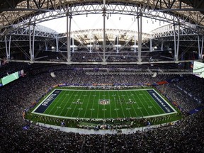 In this Feb. 1, 2015, file photo, the New England Patriots and Seattle Seahawks compete during the first half of Super Bowl XLIX in Glendale, Ariz.
