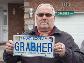 A Nova Scotia retiree has been awarded $750 following an earlier court skirmish over a report that claimed a licence plate bearing his last name supports sexual violence against women. Lorne Grabher displays his personalized licence plate in Dartmouth, N.S. on Friday, March 24, 2017.