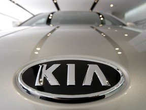 A KIA Motors logo is seen on a K7 sedan at a showroom in Seoul, South Korea on Jan. 28, 2011. (AP Photo/Ahn Young-joon)