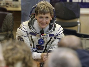 U.S. astronaut Peggy Whitson, member of the main crew of the expedition to the International Space Station (ISS), speaks with her relatives prior the launch of Soyuz MS-3 space ship at the Russian leased Baikonur cosmodrome, Kazakhstan on Nov. 17, 2016. (AP Photo/Dmitri Lovetsky)