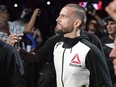 CM Punk walks to the octagon before a welterweight bout at UFC 203 in Cleveland on Sept. 10, 2016. (AP Photo/David Dermer)