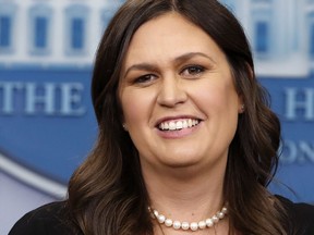 White House Press Secretary Sarah Huckabee Sanders smiles as she wishes President Donald Trump a happy birthday, during the daily briefing,  in the Briefing Room of the White House in Washington on June 14, 2018. (AP Photo/Jacquelyn Martin)