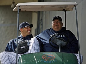 In this Feb. 19, 2010 file photo New York Yankees pitcher Andy Pettitte, left, laughs with Billy Connors, the Yankees vice president for player personnel, before pitchers and catchers worked out at Steinbrenner Field in Tampa, Fla.