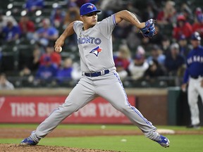 Toronto Blue Jays relief pitcher Roberto Osuna works against the Texas Rangers Friday, April 6, 2018, in Arlington, Texas. (AP Photo/Jeffrey McWhorter)