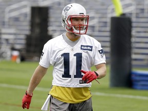 New England Patriots wide receiver Julian Edelman walks on the field during NFL football organized team activities practice at the team's training camp, in Foxborough, Mass., Tuesday, May 22, 2018. (AP Photo/Steven Senne)