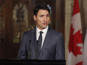 Prime Minister Justin Trudeau speaks at a press conference with French President Emmanuel Macron on Parliament Hill in Ottawa on Thursday, June 7, 2018.