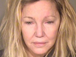 This booking photo released by the Ventura County Sheriff's Office shows actress Heather Locklear who was arrested on suspicion of fighting first responders after a report of a domestic dispute on Sunday, June 24, 2018. (Ventura County Sheriff's Office via AP) ORG XMIT: NYET127