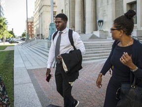 Former NFL running back Reggie Bush leaves the Civil Courts building with his legal team in St. Louis on Tuesday, June 5. (Ryan Michalesko/St. Louis Post-Dispatch via AP)