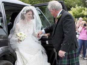 Actress Rose Leslie is escorted by her father Sebastian as they arrive for her wedding at Rayne Church, Kirkton of Rayne in Aberdeenshire, Scotland, Saturday June 23, 2018.