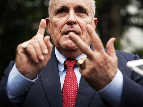 Rudy Giuliani, former New York City mayor and current lawyer for U.S. President Donald Trump, speaks to members of the media during a White House Sports and Fitness Day at the South Lawn of the White House May 30, 2018 in Washington, DC. (Getty)