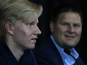 Defenceman Rasmus Dahlin, left, addresses the media as Buffalo Sabres general manager Jason Botterill looks on during a news conference, Monday, June 25, 2018, in Buffalo N.Y.