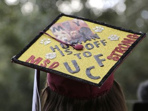 Graduate Shannon Recor leaves a graduation ceremony for Marjory Stoneman Douglas seniors, Sunday, June 3, 2018, in Sunrise, Fla. The senior class from Florida's Parkland high school where a gunman killed 17 people in February received diplomas Sunday and heard from surprise commencement speaker Jimmy Fallon, who urged graduates to move forward and "don't let anything stop you."