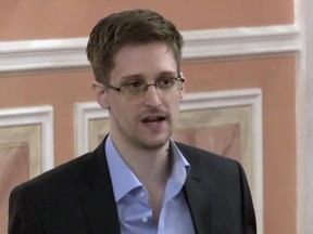 In this file image made from video released by WikiLeaks on Oct. 11, 2013, former National Security Agency systems analyst Edward Snowden speaks in Moscow.