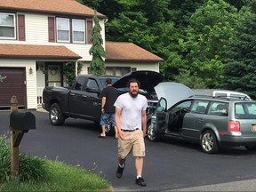 Michael Rotondo, 30, prepares to leave his parents' house in Camillus, N.Y., Friday, June 1, 2018. Rotondo, whose eviction from his parents' home drew national attention finally left Friday, hours before a court-ordered deadline. (Douglass Dowty/The Post-Standard via AP)