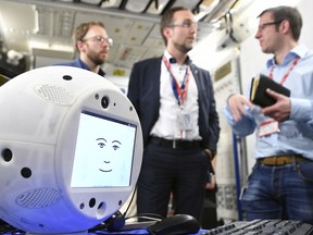 This Jan. 30, 2018 photo provided by the German Aerospace Center shows the "Cimon" (Crew Interactive MObile companioN) robot during a communications test at the ESA European Astronaut Center in Cologne-Porz, Germany. (T. Bourry/ESA/DLR via AP)