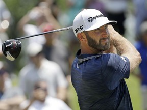 Dustin Johnson watches his drive on the first hole during the final round of the St. Jude Classic golf tournament Sunday, June 10, 2018, in Memphis, Tenn.