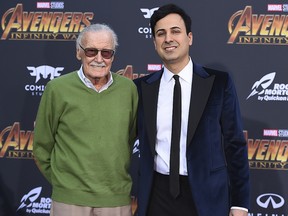 In this April 23, 2018 file photo, Stan Lee, left, and Keya Morgan arrive at the world premiere of "Avengers: Infinity War" in Los Angeles. (Jordan Strauss/Invision/AP, File)