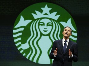 Howard Schultz, chairman and CEO of Starbucks Coffee Company, speaks at the company's annual shareholders meeting in Seattle on March 19, 2004. (AP Photo/Ted S. Warren)