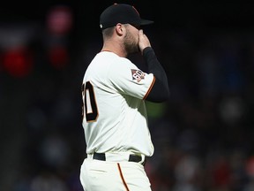 San Francisco Giants' Hunter Strickland reacts after giving up a hit to Miguel Rojas of the Miami Marlins that scored the go-ahead run in the bottom of the ninth inning against the San Francisco Giants at AT&T Park on June 18, 2018 in San Francisco.