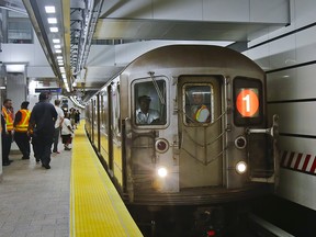 In this June 27, 2017 file photo, the No. 1 subway train pulls into the South Ferry Station in New York. (AP Photo/Bebeto Matthews)