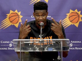 NBA Draft prospect Deandre Ayton, who may be the Phoenix Suns' choice with the No. 1 overall pick in this month's NBA draft, talks to the media after an individual workout with the Suns, Wednesday, June 6, 2018 in Phoenix. (AP Photo/Matt York)