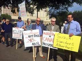 Protesters gather outside the Jubilee Auditorium in advance of David Suzuki's U of A honorary degree ceremony on Thursday, June 7, 2018