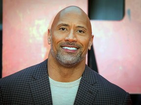 FILE - In this April 11, 2018, file photo, actor Dwayne Johnson poses for photographers at the premiere of the "Rampage," in London. Johnson has a new friend on social media and he lives under the sea. SpongeBob Squarepants on Friday, June 1, tagged Johnson in a tweet asking what inspired his nickname.