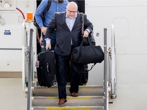 Washington Capitals head coach Barry Trotz arrives with the team at Dulles International Airport in Sterling, Va., on June 8, 2018