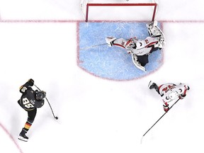 Washington Capitals' Braden Holtby makes a diving stick-save on Vegas Golden Knights' Alex Tuch during the third period in Game 2 of the 2018 NHL Stanley Cup Final at T-Mobile Arena on May 30, 2018 in Las Vegas.