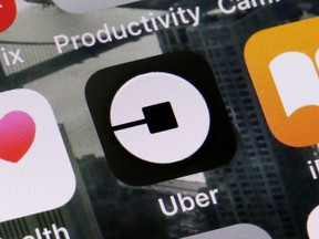 The Uber app is shown on a phone in New York, Tuesday, June 12, 2018.