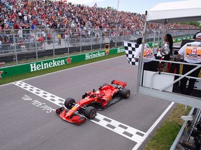 Ferrari's Sebastian Vettel of Germany crosses the finish line to win the Canadian Grand Prix Sunday, June 10, 2018 in Montreal.