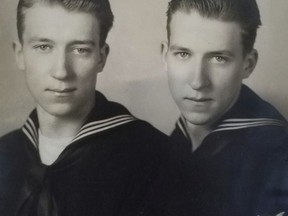 In this undated photo, provided by family member Susan Lawrence on Wednesday, June 13, 2018, twin brothers Julius Pieper, left, and Ludwig Pieper in their U.S. Navy uniforms. (Susan Lawrence via AP)